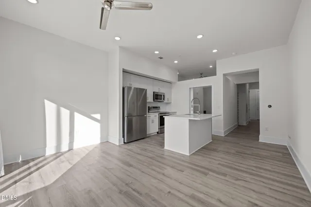a view of kitchen with wooden floor