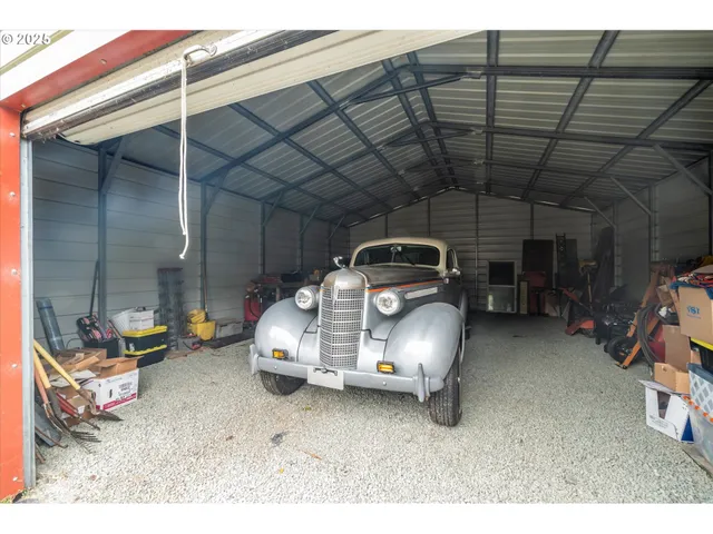 a view of a garage with parked cars