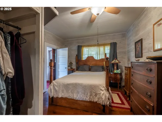 a bed room with a bed and a television