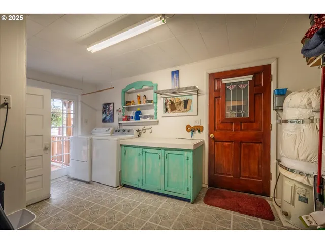 a kitchen with cabinets and wooden floor