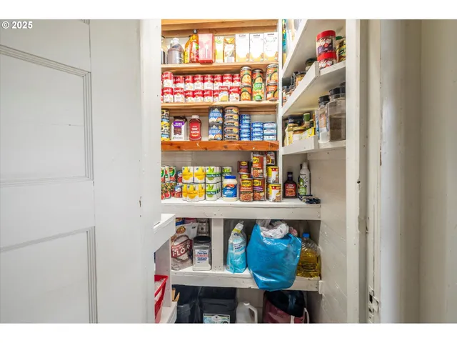 a room with lots of books and a sink
