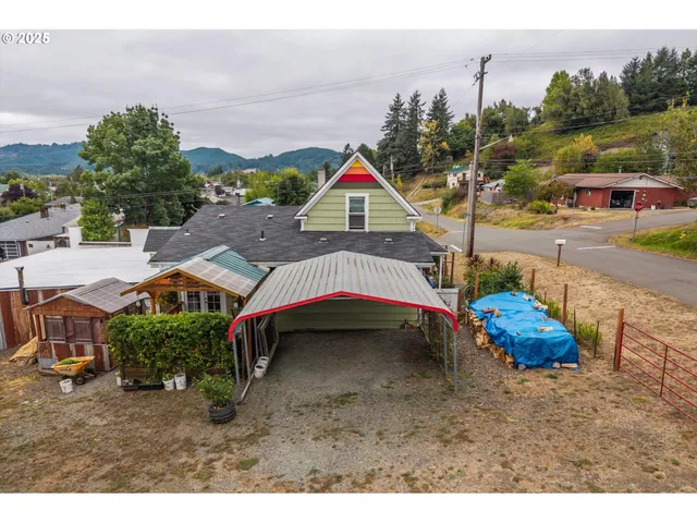 a aerial view of a house with a yard