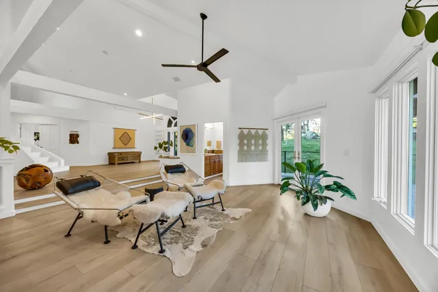 a kitchen with stainless steel appliances granite countertop a stove top oven and cabinets