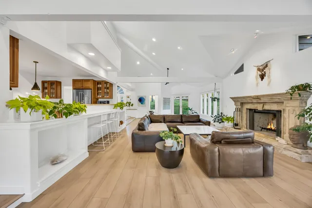 a white bath tub sitting in a bathroom next to a window