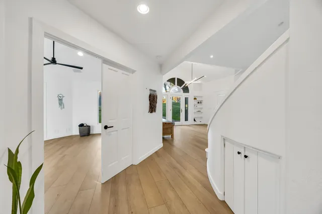 a living room with furniture a rug and a flat screen tv