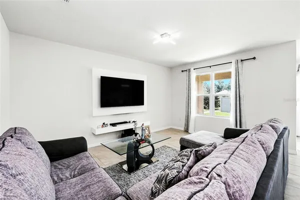 a living room with furniture and a couch