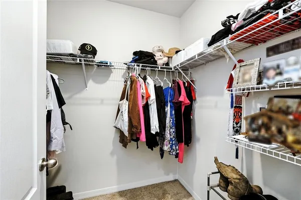 a bedroom with a bed and a table in it