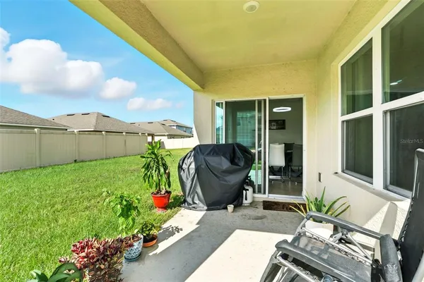 a view of front of house with outdoor space and seating