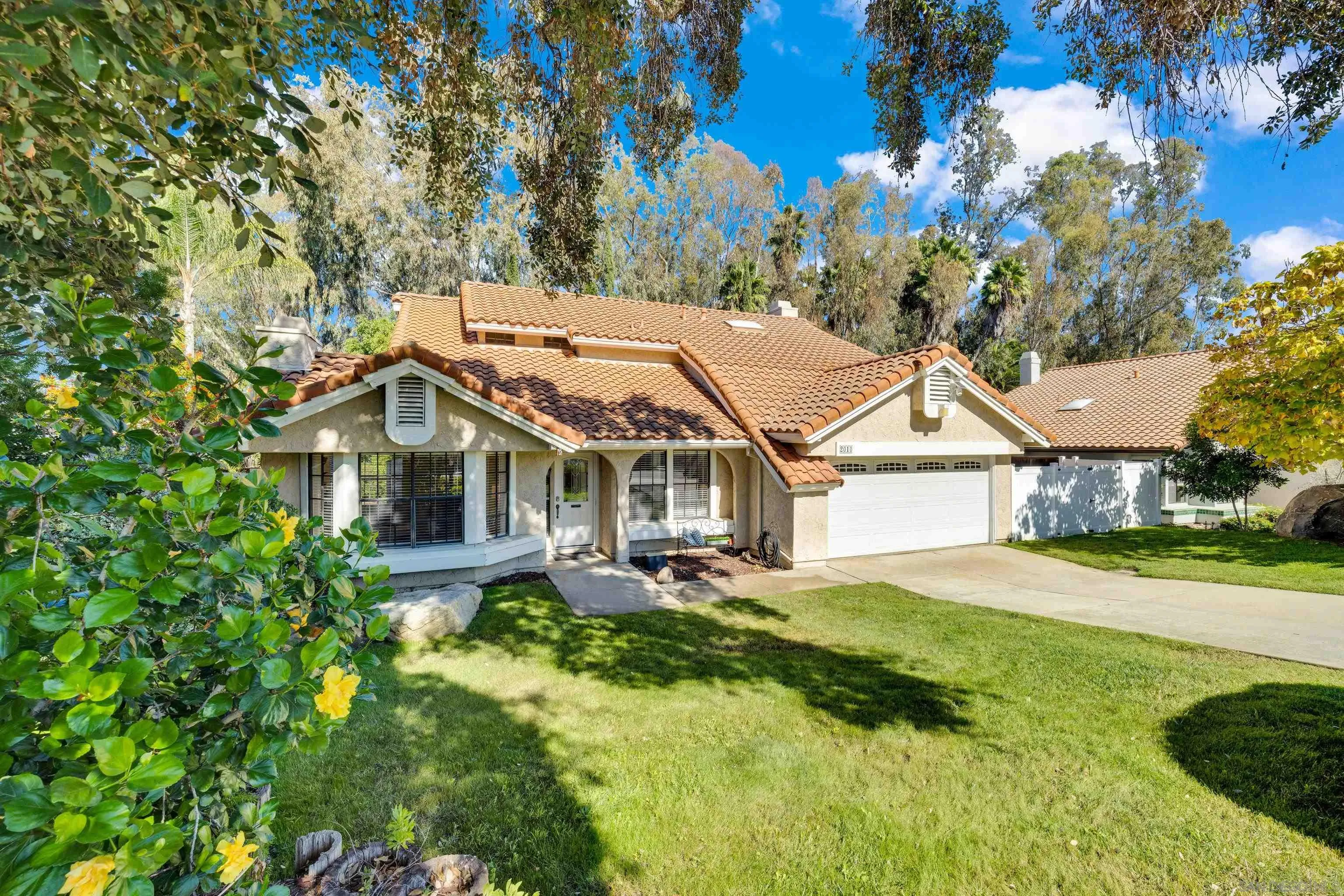 2010 Palsero Avenue Escondido, CA 92029 - Photo 1 of 58 a front view of a house with a yard and large trees