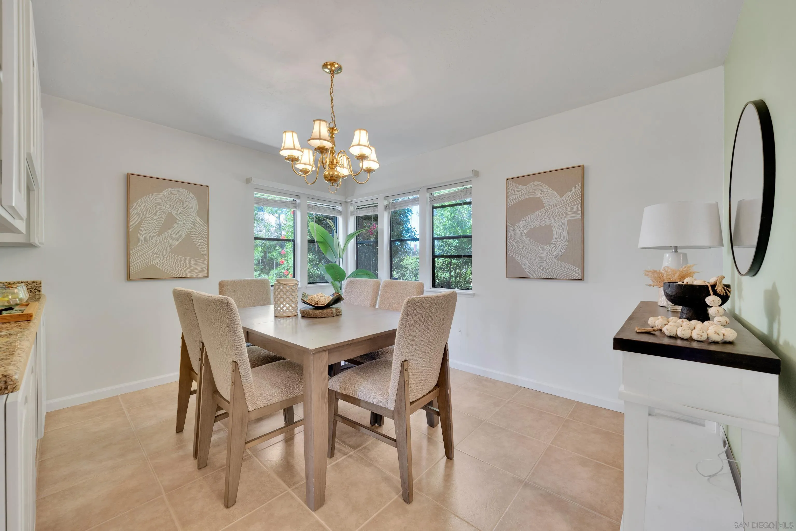 2010 Palsero Avenue Escondido, CA 92029 - Photo 11 of 58 a view of a dining room with furniture a chandelier and wooden floor