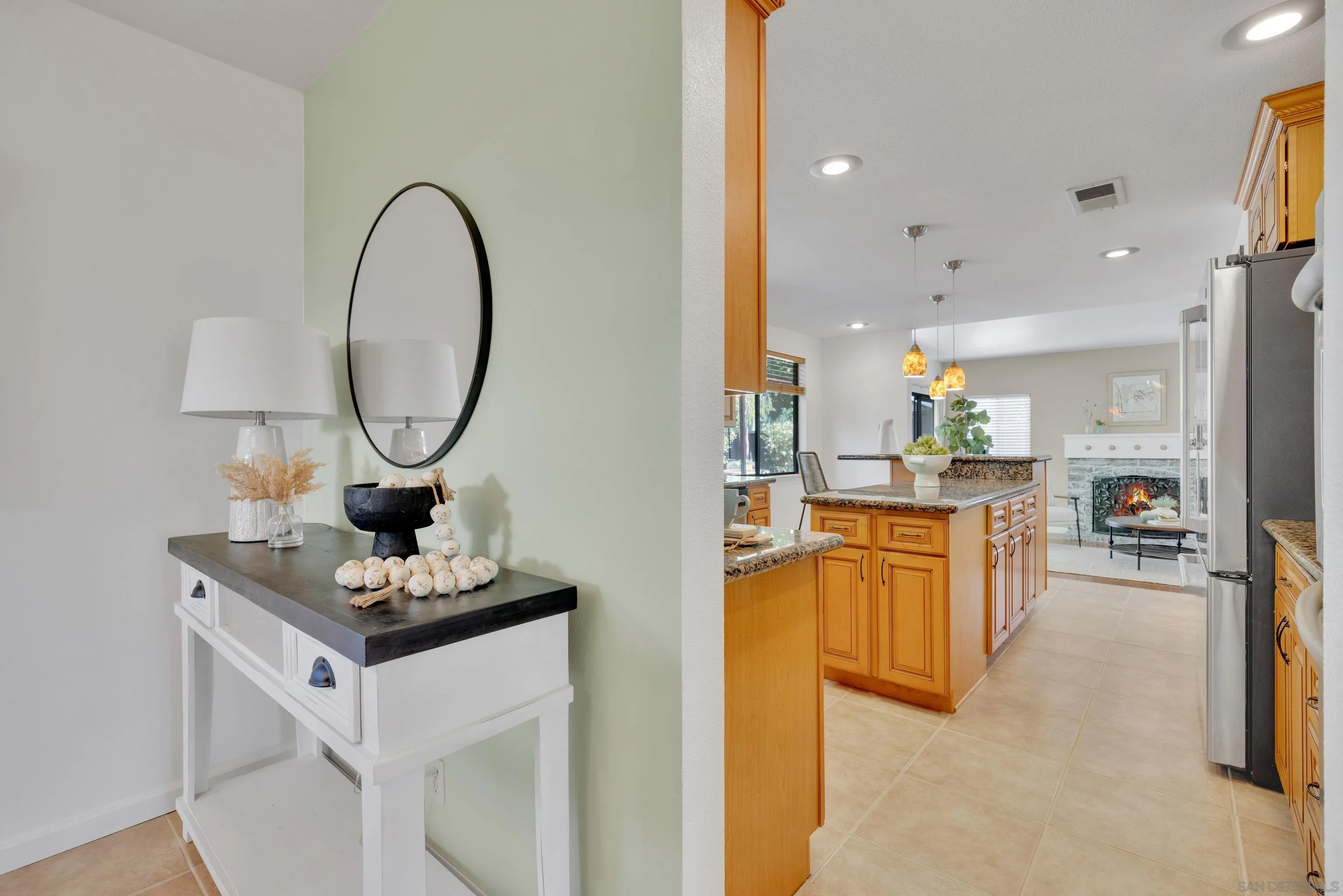 2010 Palsero Avenue Escondido, CA 92029 - Photo 13 of 58 a living room with stainless steel appliances furniture a rug and a kitchen view