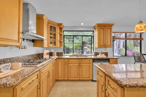 a view of kitchen with furniture and refrigerator