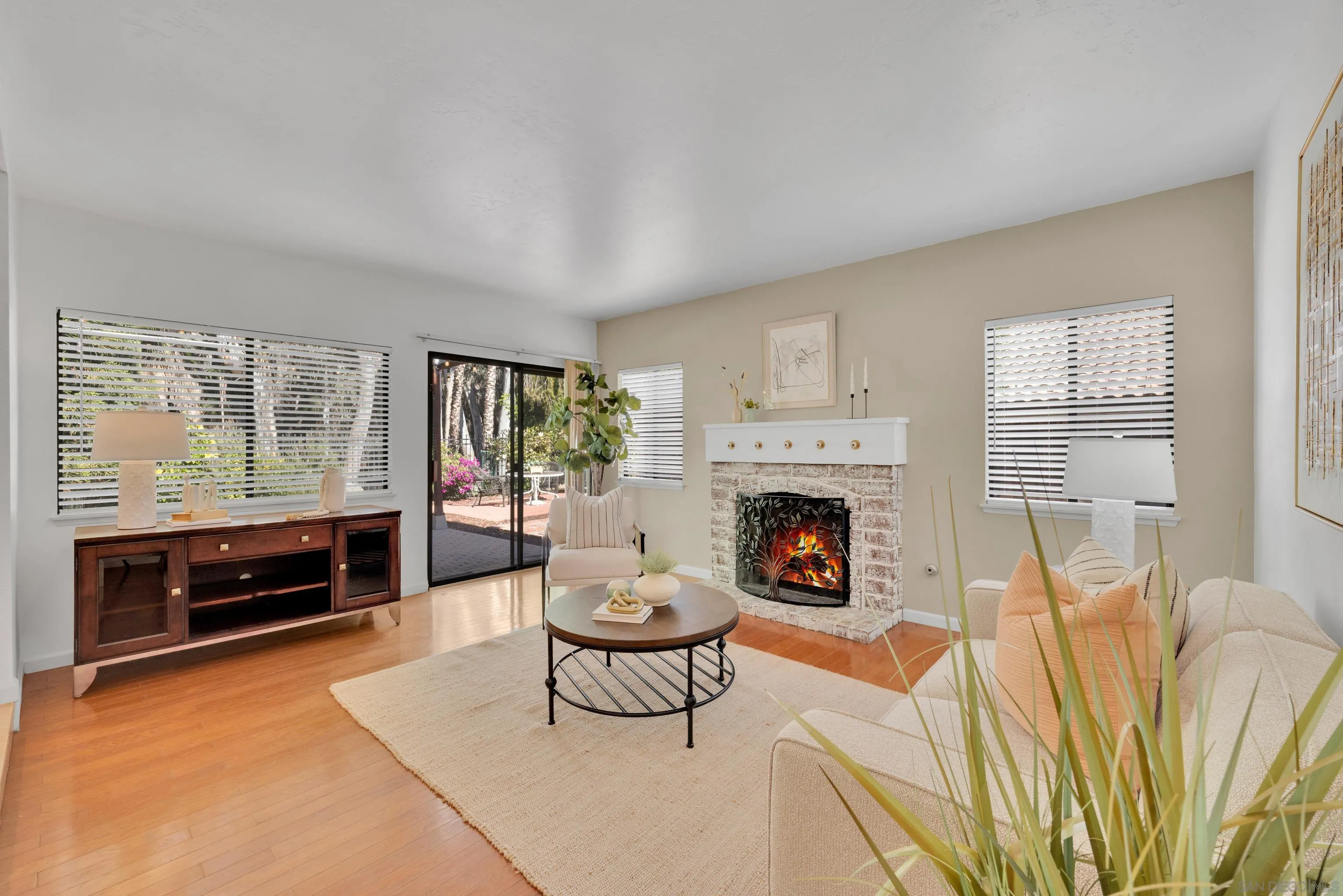 2010 Palsero Avenue Escondido, CA 92029 - Photo 21 of 58 a living room with furniture a flat screen tv and a fireplace