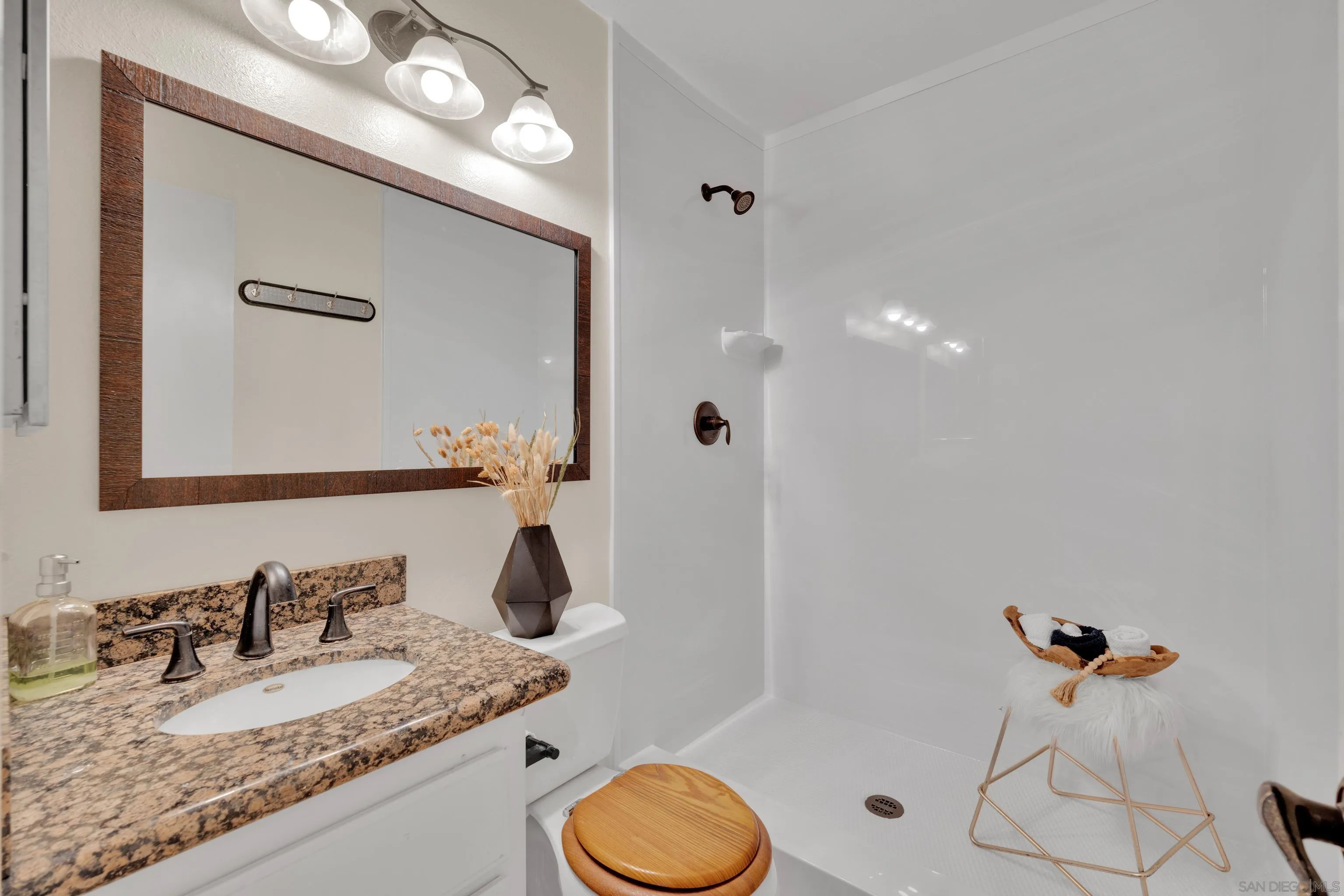 2010 Palsero Avenue Escondido, CA 92029 - Photo 26 of 58 a bathroom with a granite countertop sink and a mirror
