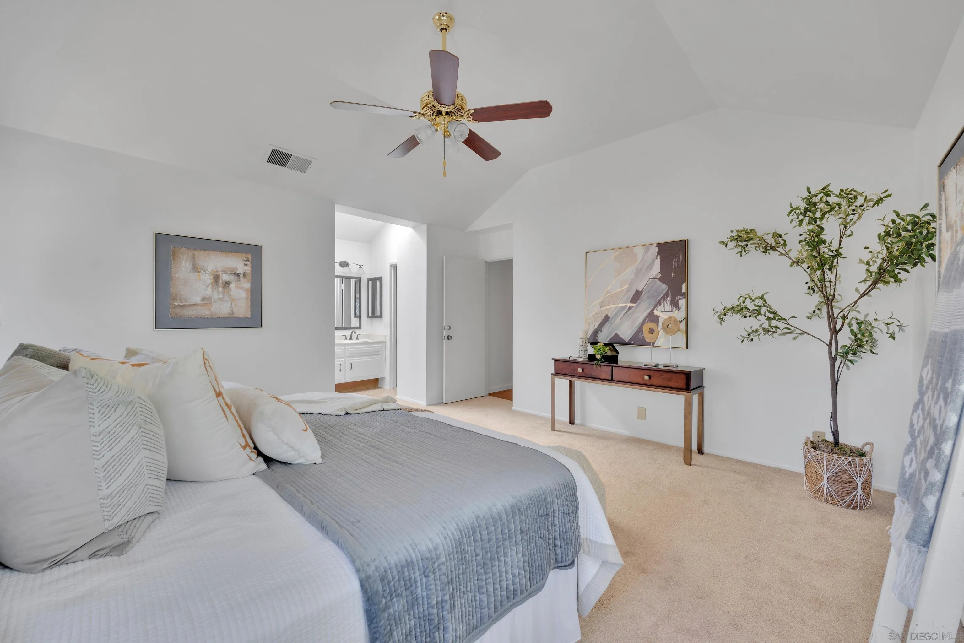 2010 Palsero Avenue Escondido, CA 92029 - Photo 31 of 58 a bedroom with a bed and a chandelier