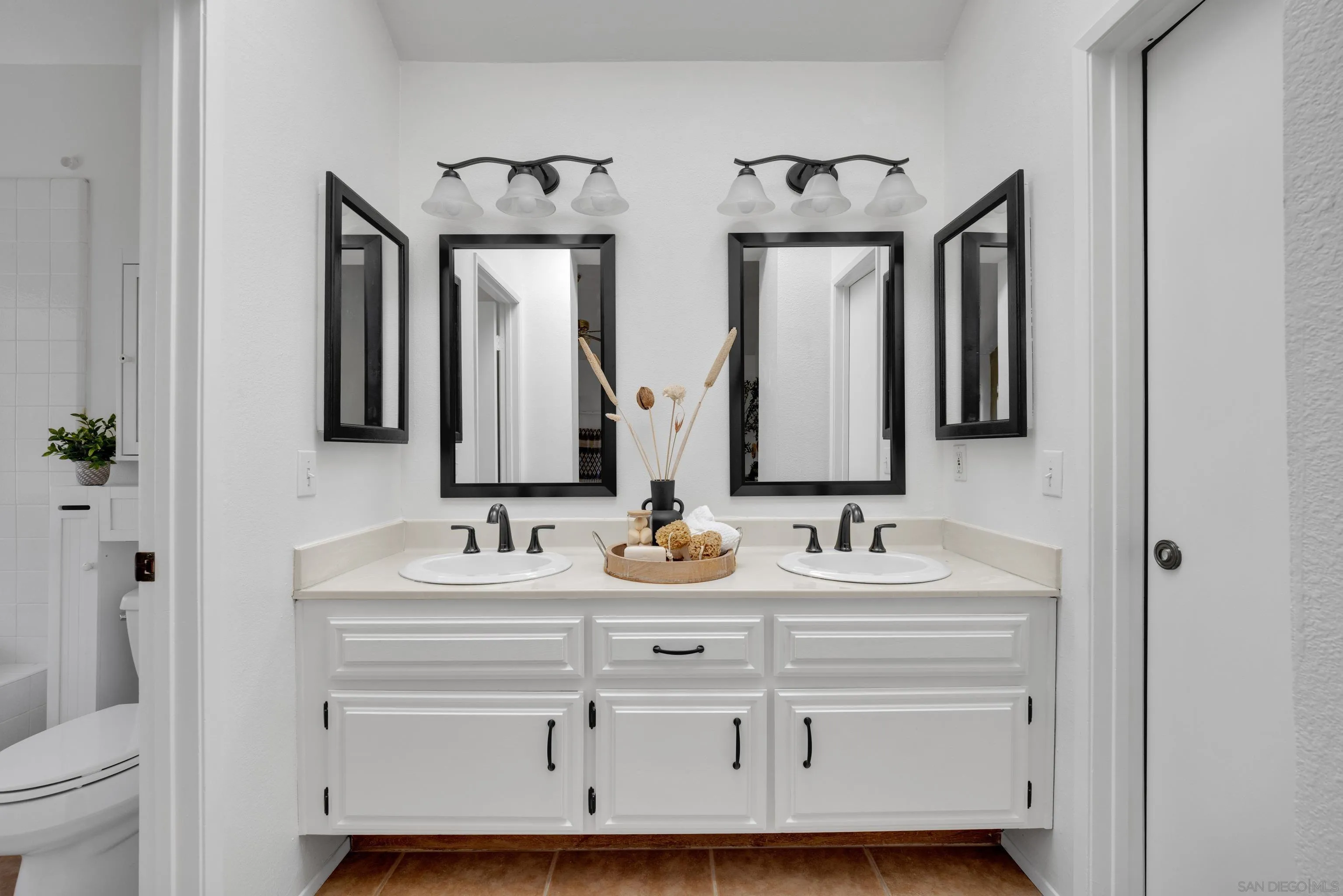 2010 Palsero Avenue Escondido, CA 92029 - Photo 33 of 58 a bathroom with double vanity sinks and a mirror