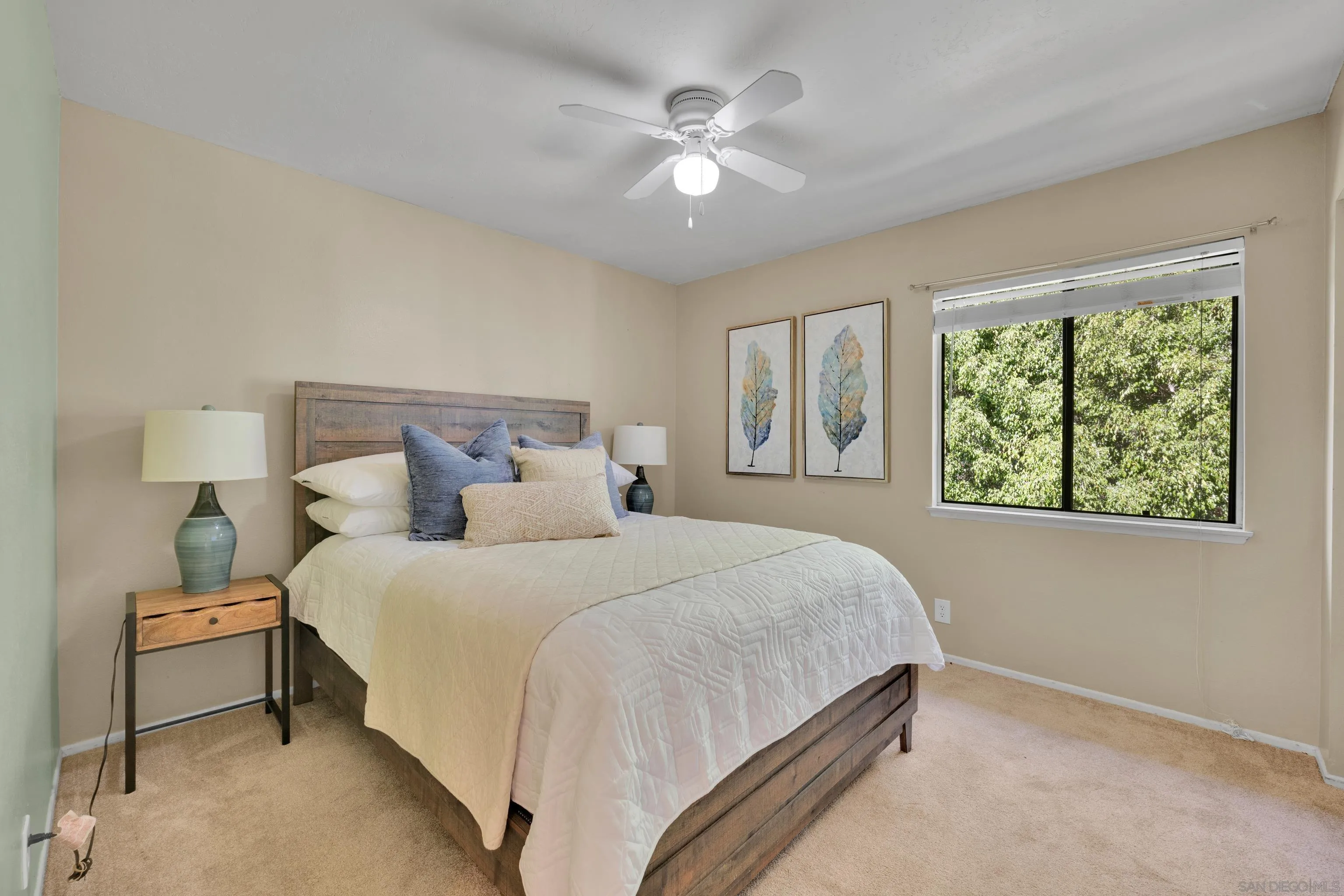 2010 Palsero Avenue Escondido, CA 92029 - Photo 37 of 58 a bedroom with a large bed and a chandelier