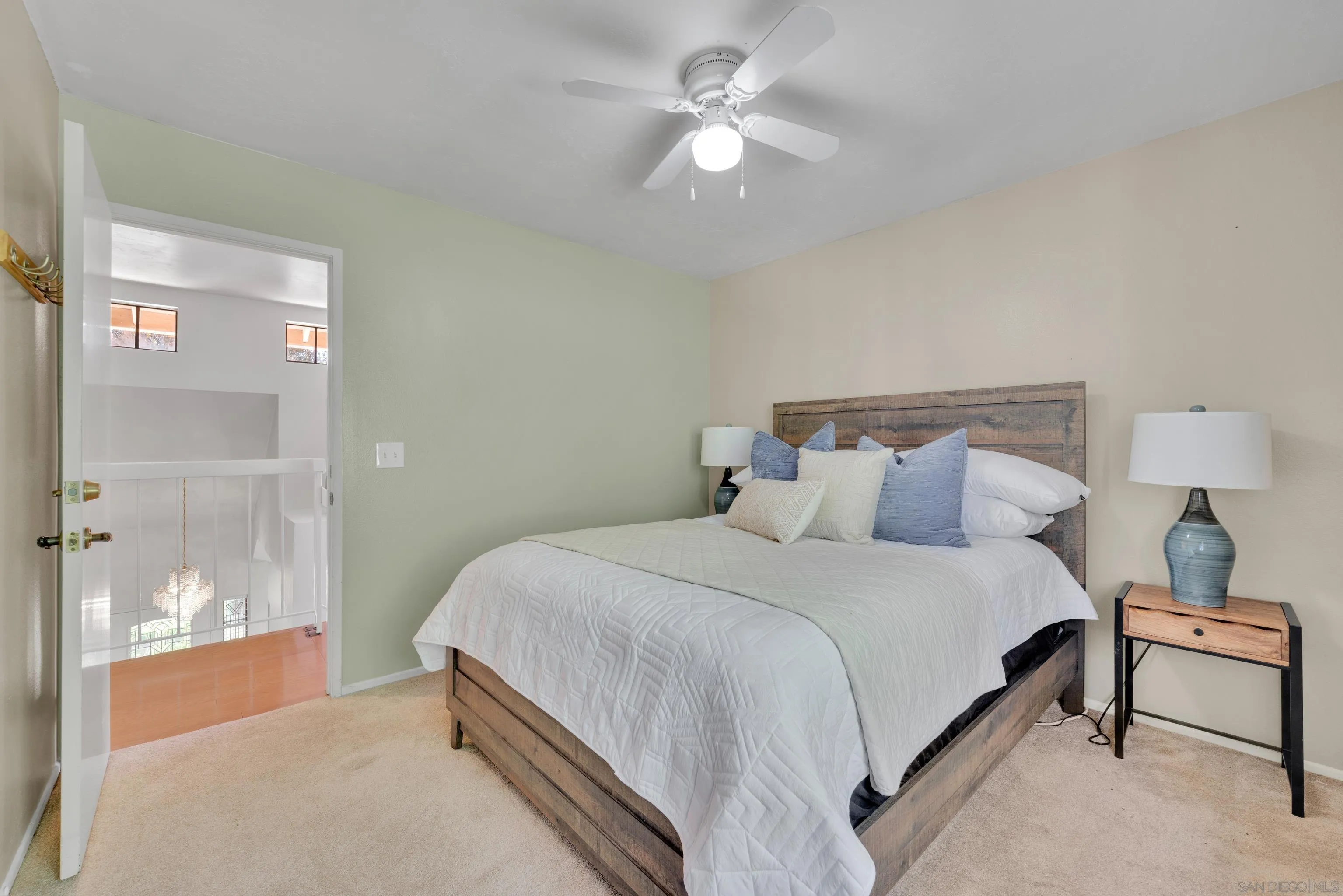 2010 Palsero Avenue Escondido, CA 92029 - Photo 38 of 58 a bedroom with a bed and a chandelier