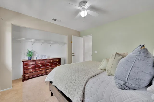 a view of a backyard with a patio and outdoor seating