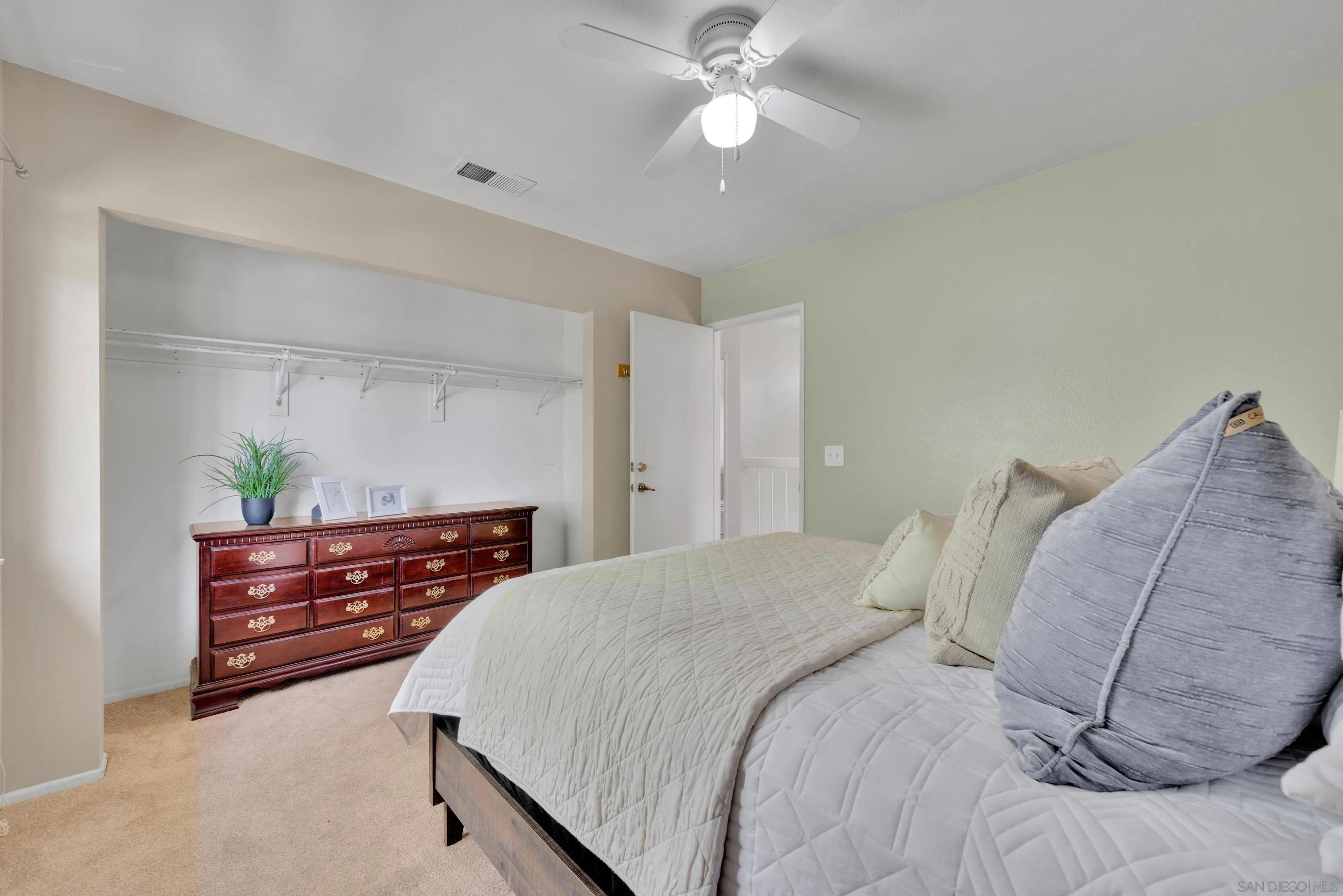 2010 Palsero Avenue Escondido, CA 92029 - Photo 39 of 58 a bedroom with a bed and a chandelier