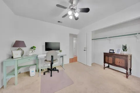 a backyard of a house with barbeque oven table and chairs