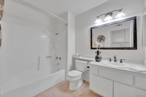 a view of a patio with table and chairs and potted plants