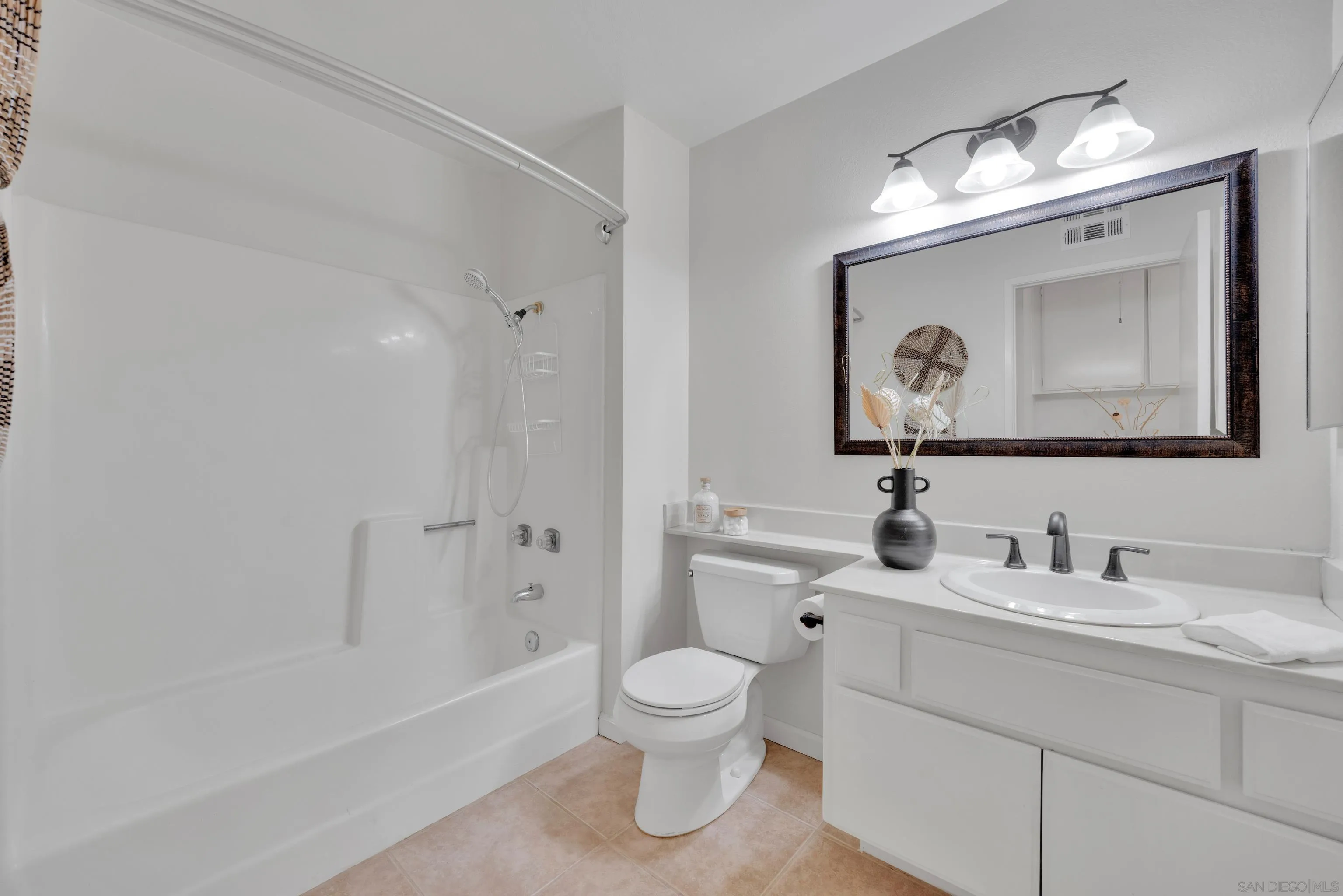 2010 Palsero Avenue Escondido, CA 92029 - Photo 42 of 58 a bathroom with a toilet a sink and a mirror