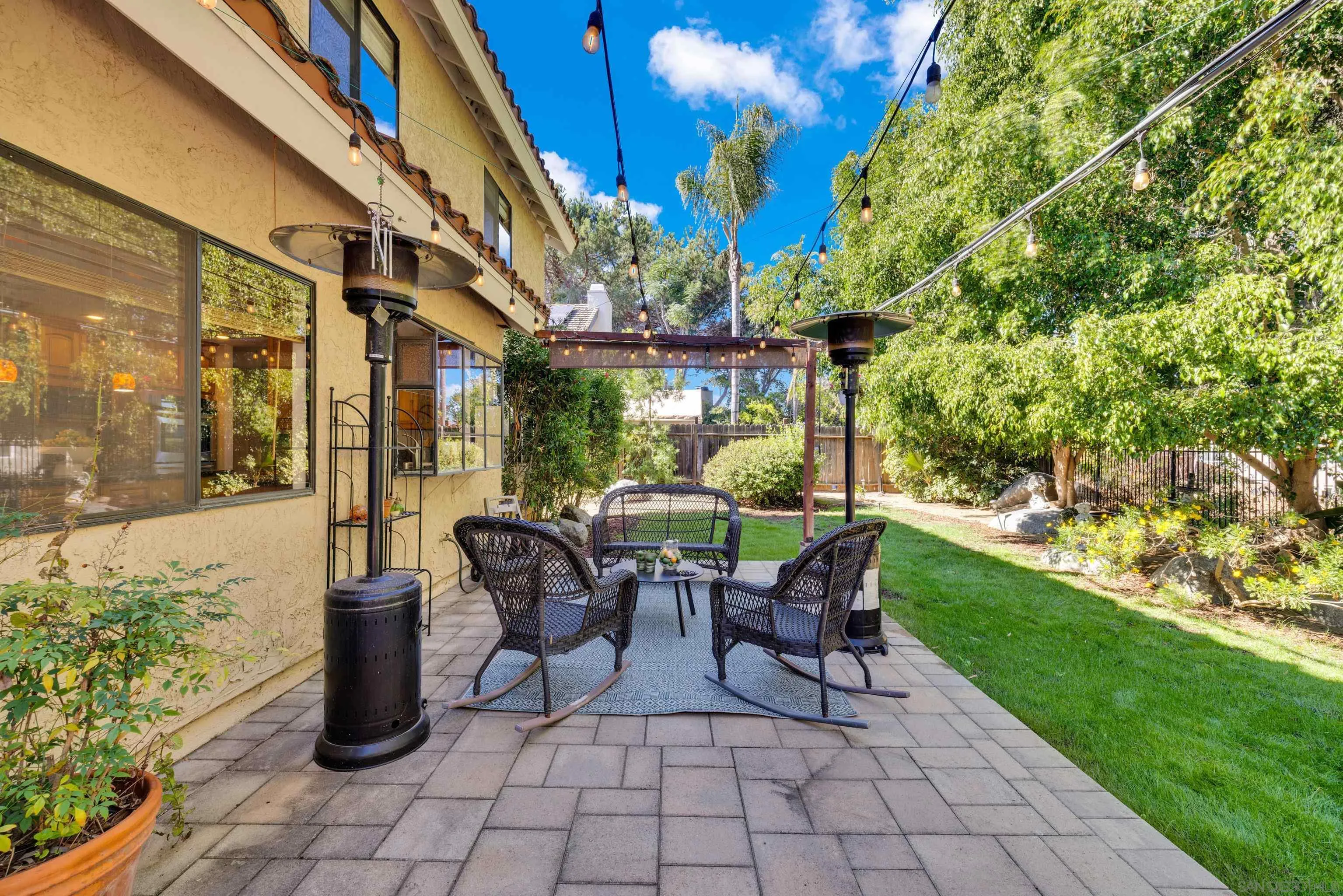 2010 Palsero Avenue Escondido, CA 92029 - Photo 44 of 58 a view of a patio with table and chairs potted plants and large tree