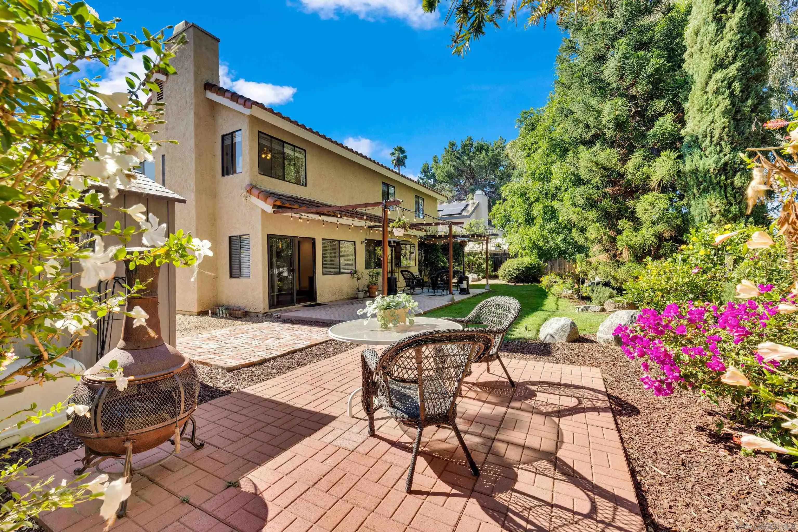 2010 Palsero Avenue Escondido, CA 92029 - Photo 46 of 58 a view of a patio with table and chairs and potted plants