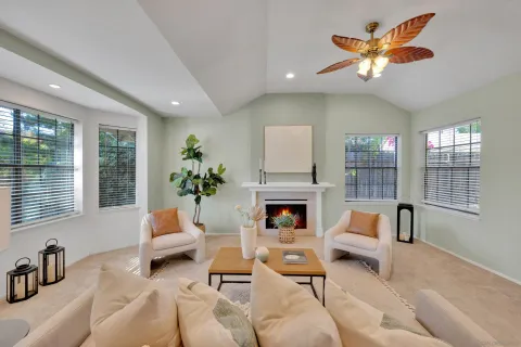 a view of a dining room with furniture a chandelier and wooden floor