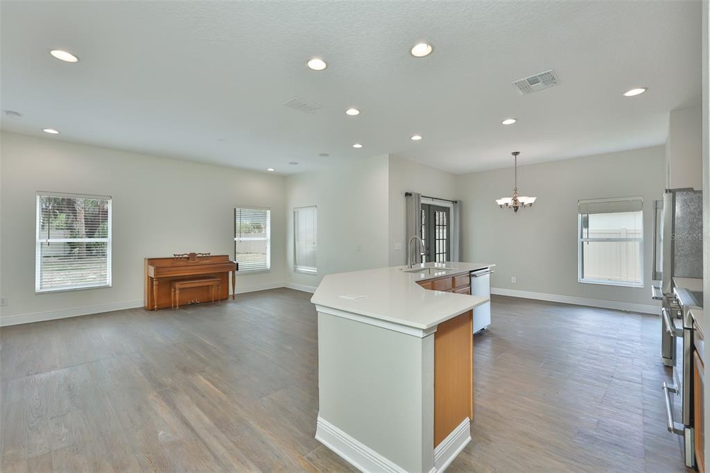 708 Coade Stone Drive Seffner, FL 33584 - Photo 10 of 48 a kitchen with sink and refrigerator