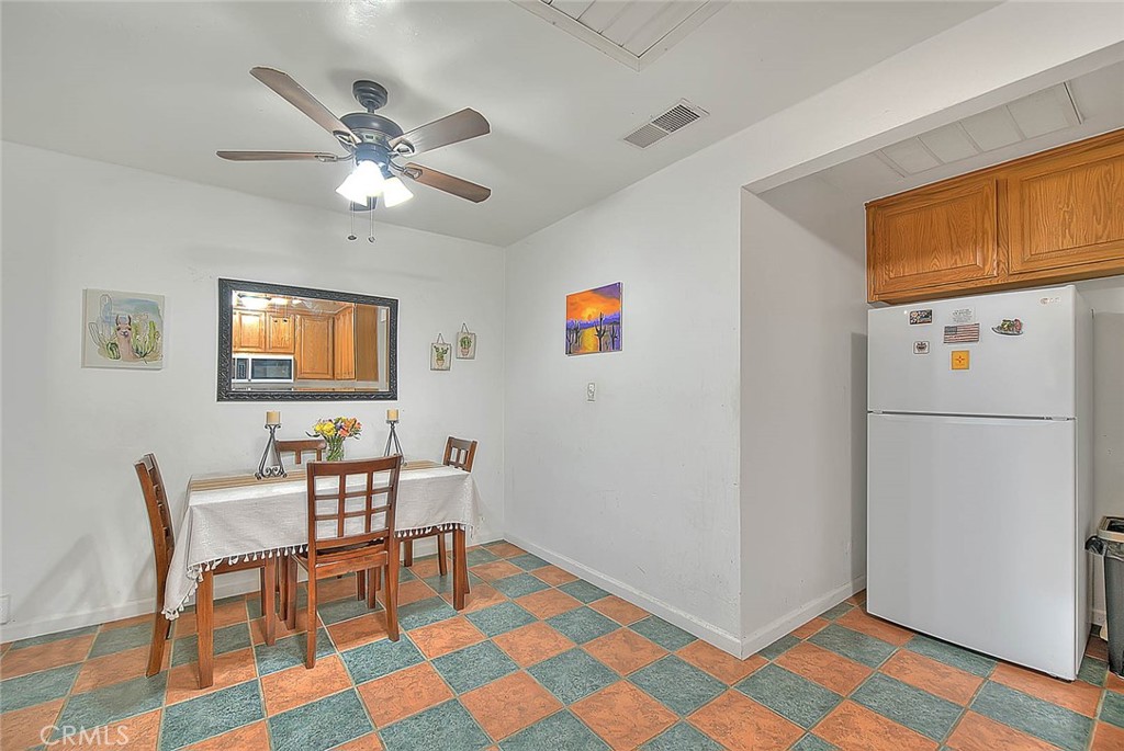 1042 Frontier Road Norco, CA 92860 - Photo 12 of 62 a view of a livingroom with furniture and a ceiling fan
