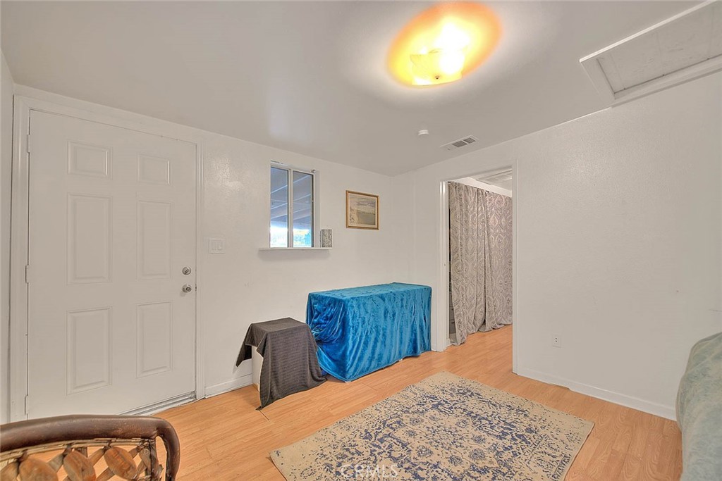 1042 Frontier Road Norco, CA 92860 - Photo 33 of 62 a bedroom with a bed and a dresser