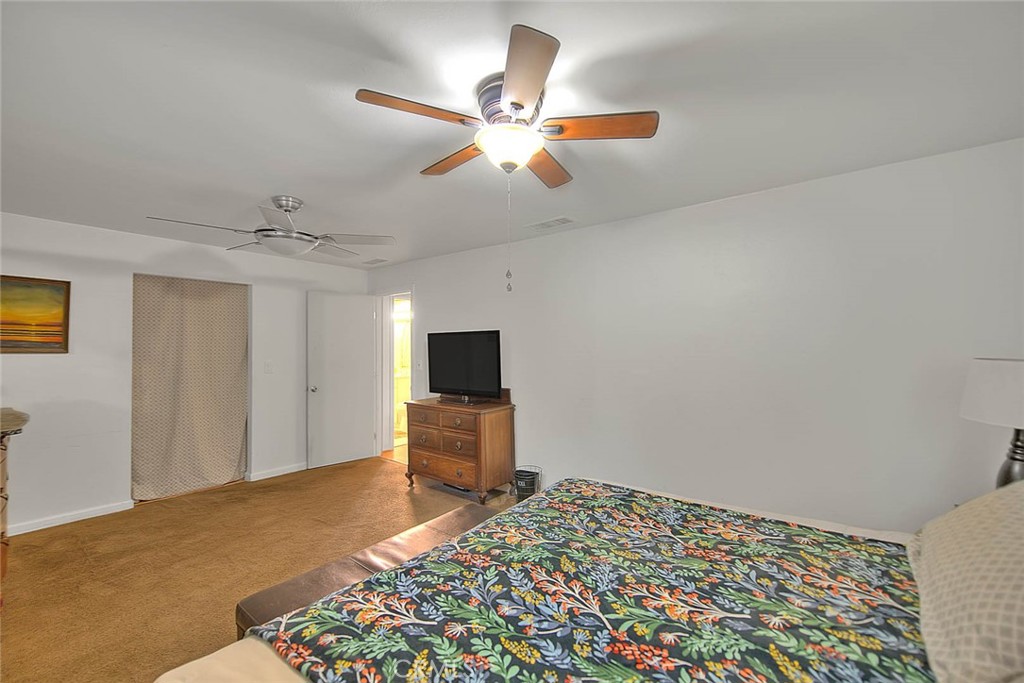 1042 Frontier Road Norco, CA 92860 - Photo 36 of 62 a bedroom with a bed and a television