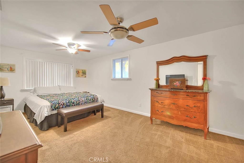 1042 Frontier Road Norco, CA 92860 - Photo 40 of 62 a living room with furniture and a chandelier