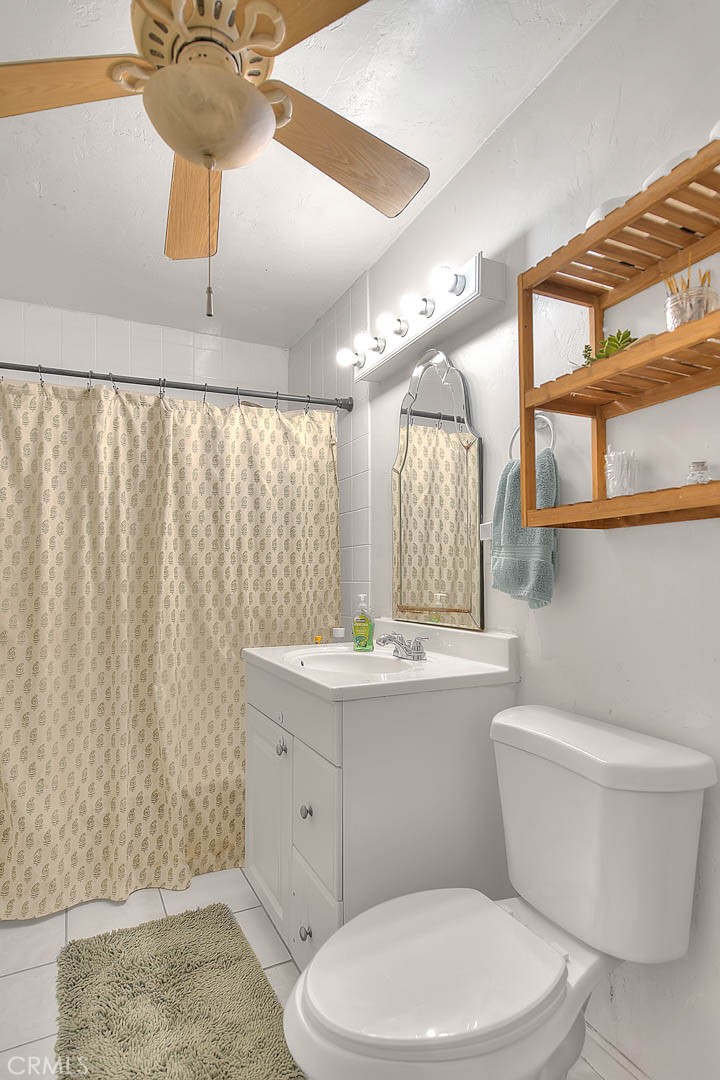 1042 Frontier Road Norco, CA 92860 - Photo 47 of 62 a bathroom with a sink a toilet and shower