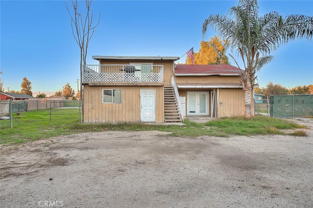 1042 Frontier Road Norco, CA 92860 - Photo 57 of 62 a front view of a house with a yard and garage