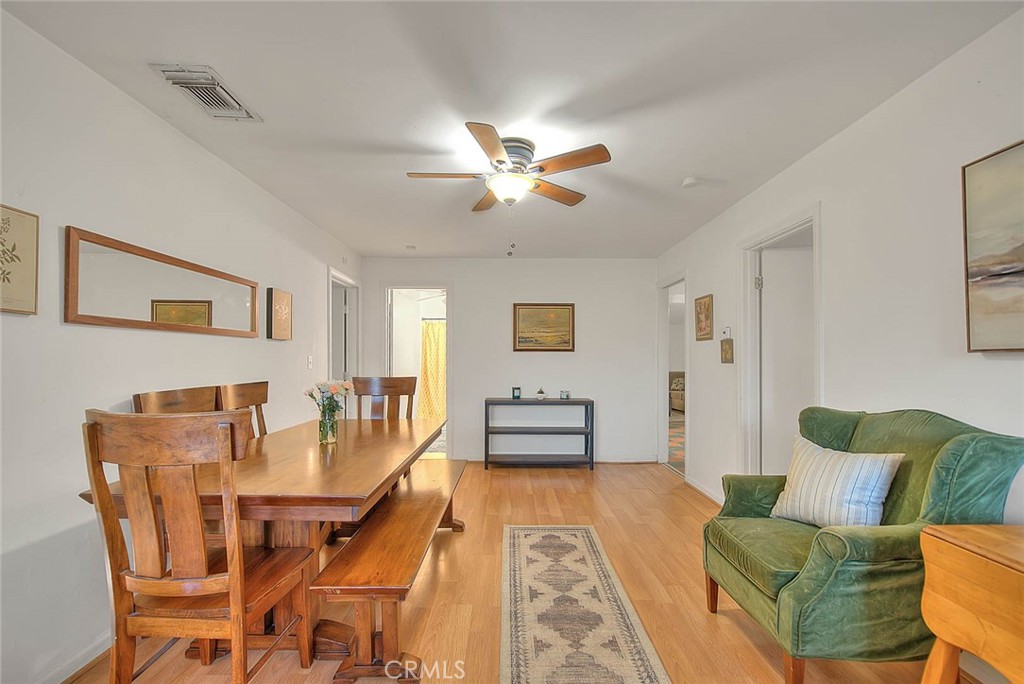 1042 Frontier Road Norco, CA 92860 - Photo 9 of 62 a dining room with furniture and wooden floor