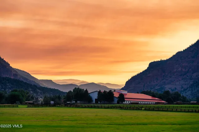 a view of house with outdoor space and garden