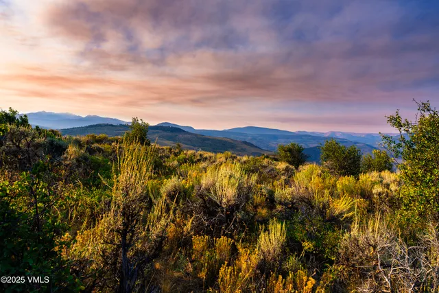 a view of sunset and a mountain