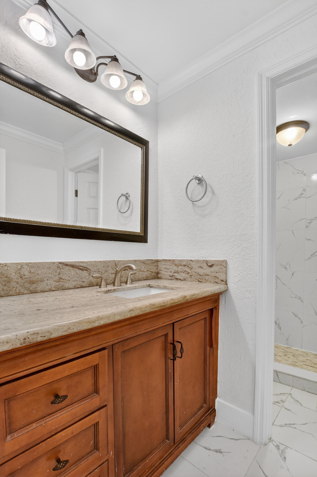 636 Northwest 13th Street, Unit 110 Boca Raton, FL 33486 - Photo 25 of 35 a bathroom with a sink and a mirror