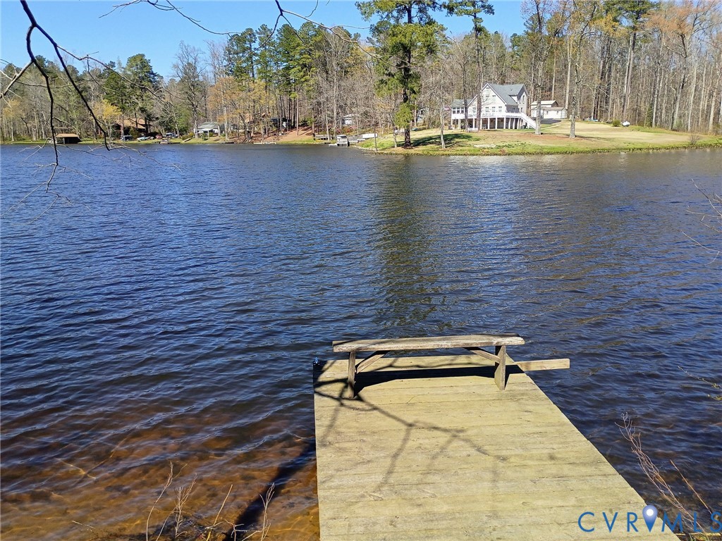51-52 Crystal Lake Crewe, VA 23930 - Photo 1 of 18 a view of swimming pool and lake in the back