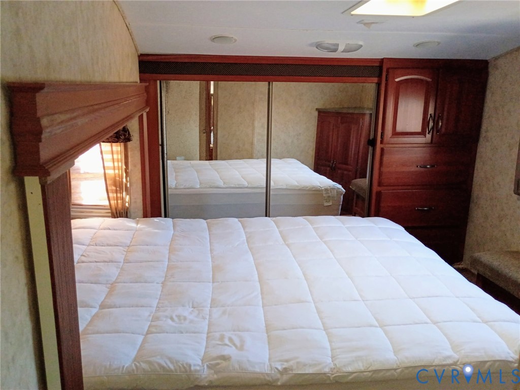 51-52 Crystal Lake Crewe, VA 23930 - Photo 15 of 18 a bedroom with a large bed and a large window