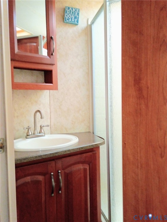 51-52 Crystal Lake Crewe, VA 23930 - Photo 16 of 18 a bathroom with a sink and a mirror
