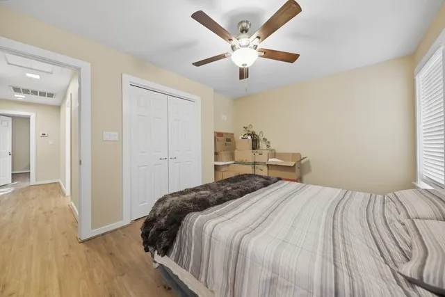 a bedroom with a bed and window