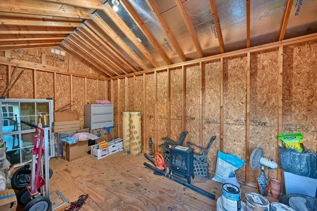 a picture of a bench in front of a wall