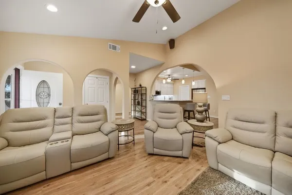 a living room with furniture and a large window