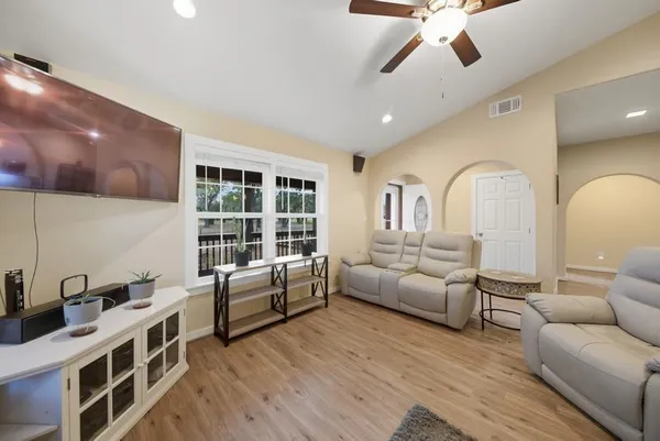 a living room with furniture and a large window