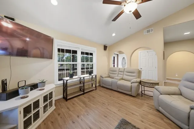a living room with furniture and a large window