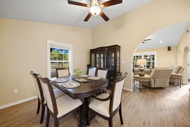 a view of a dining room with furniture window and wooden floor